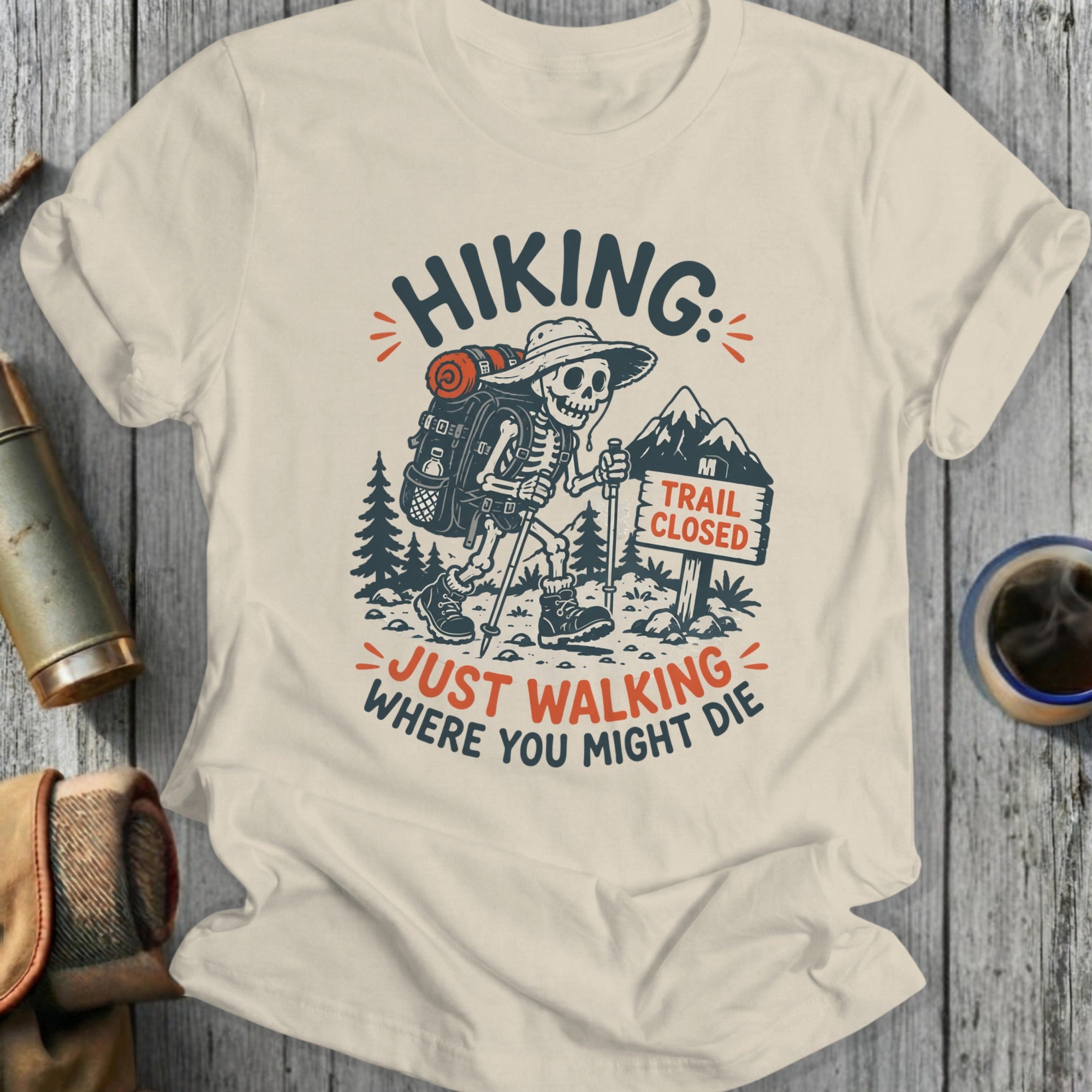 Skeleton hiker with backpack and "Trail Closed" sign, "Hiking: Just Walking Where You Might Die" text.
