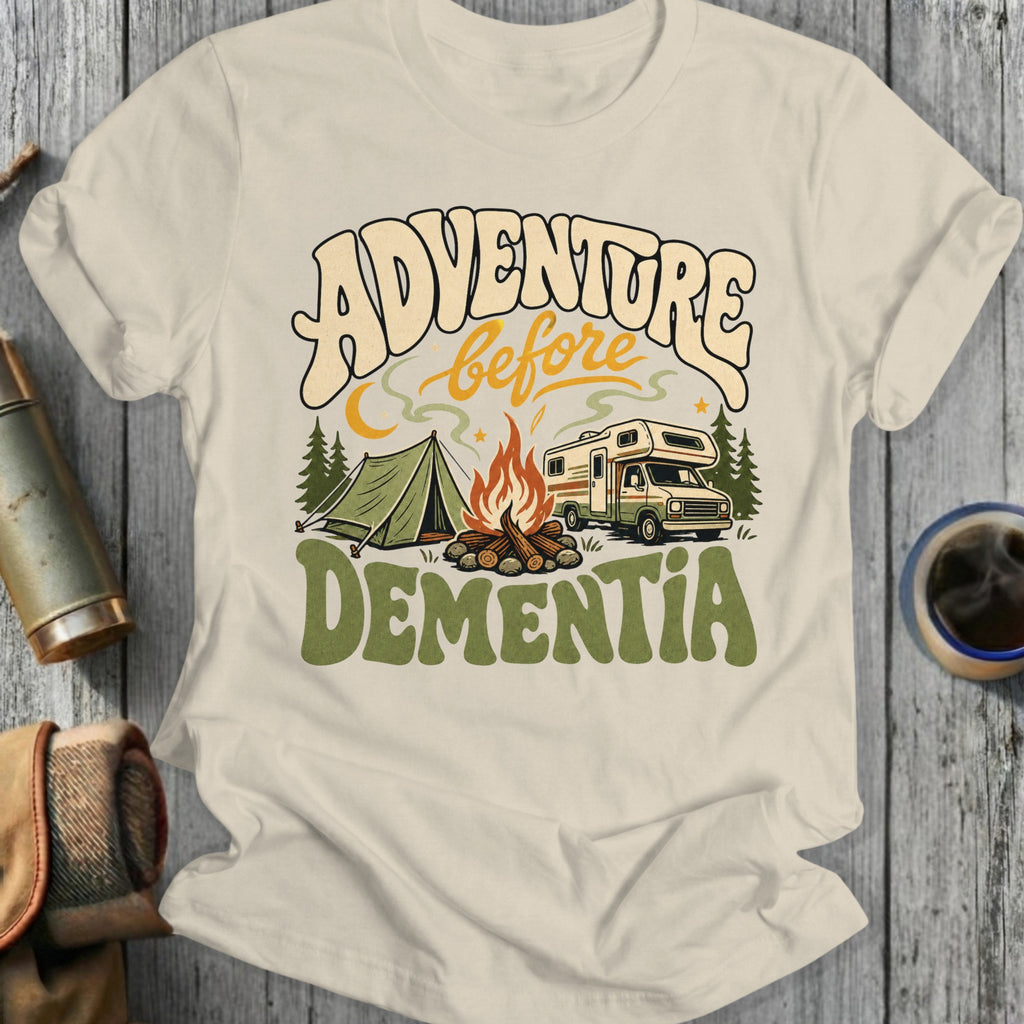 Cream t-shirt with "Adventure Before Dementia" text and camping scene graphic.