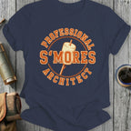 "Professional S'mores Architect" text on a dark blue t-shirt with a marshmallow on a stick.