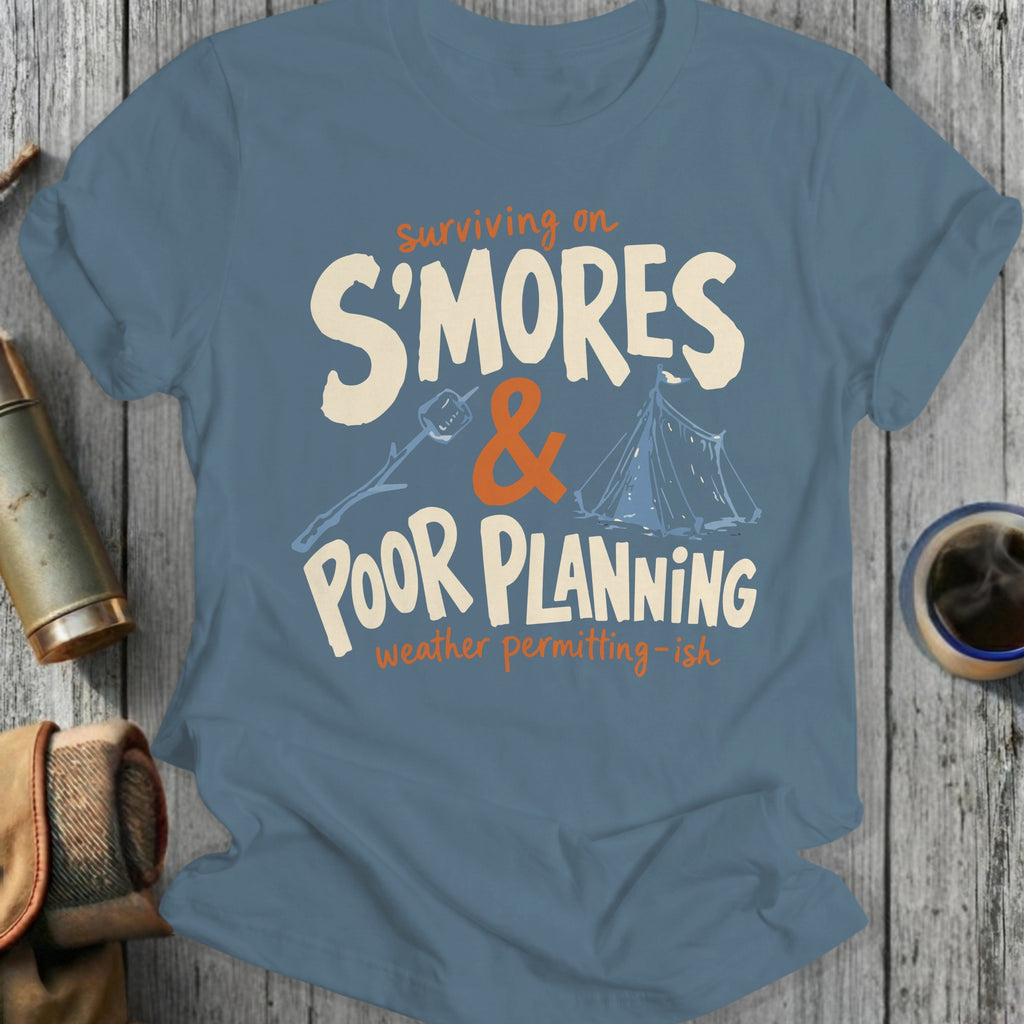 Blue t-shirt with "Surviving on S'mores & Poor Planning" text and camping graphics.