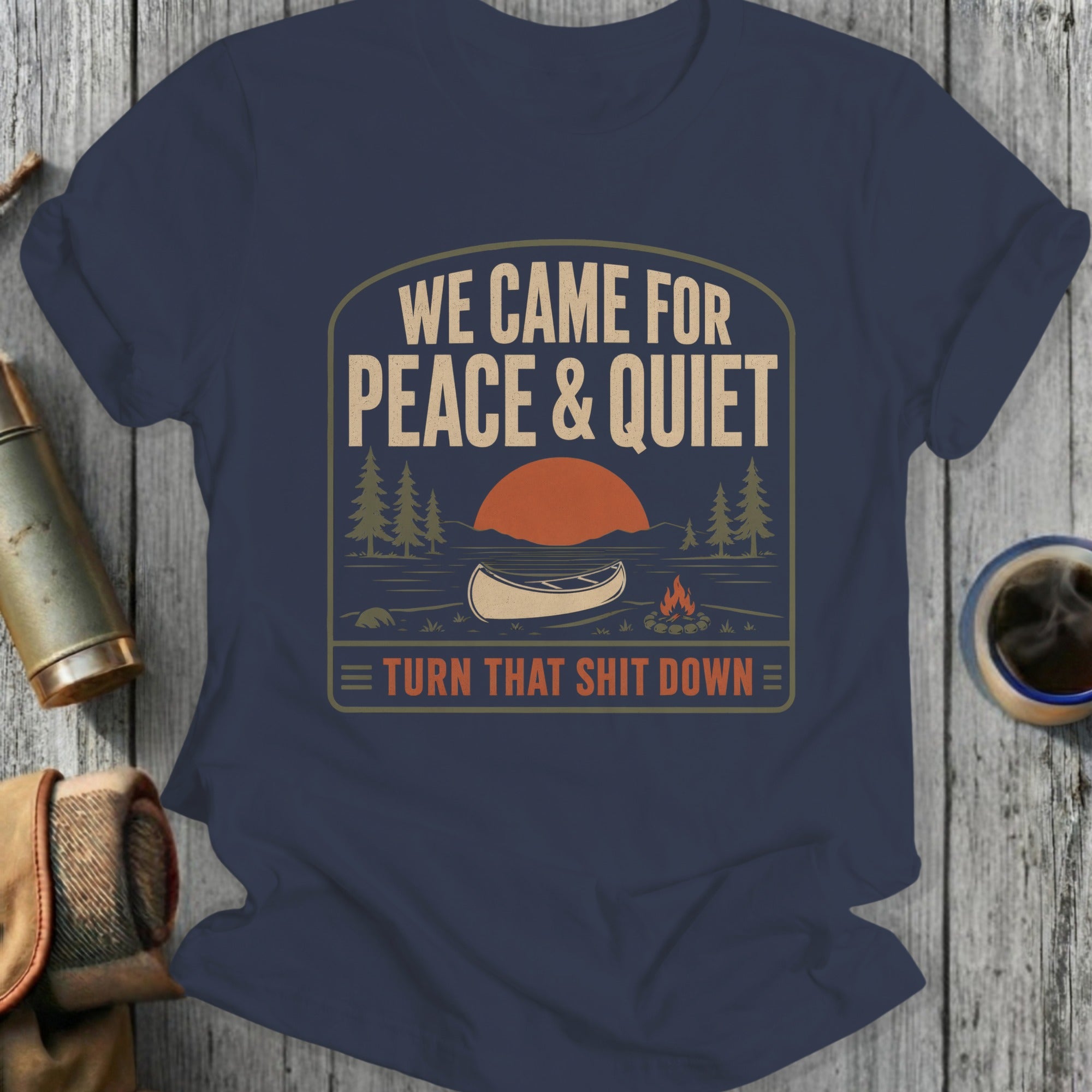 Navy t-shirt with "We Came For Peace & Quiet" graphic.