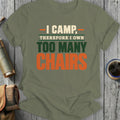 Olive green t-shirt with "I CAMP, THEREFORE I OWN TOO MANY CHAIRS" text.