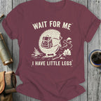 Burgundy t-shirt with hedgehog graphic, backpack, and text "WAIT FOR ME I HAVE LITTLE LEGS".