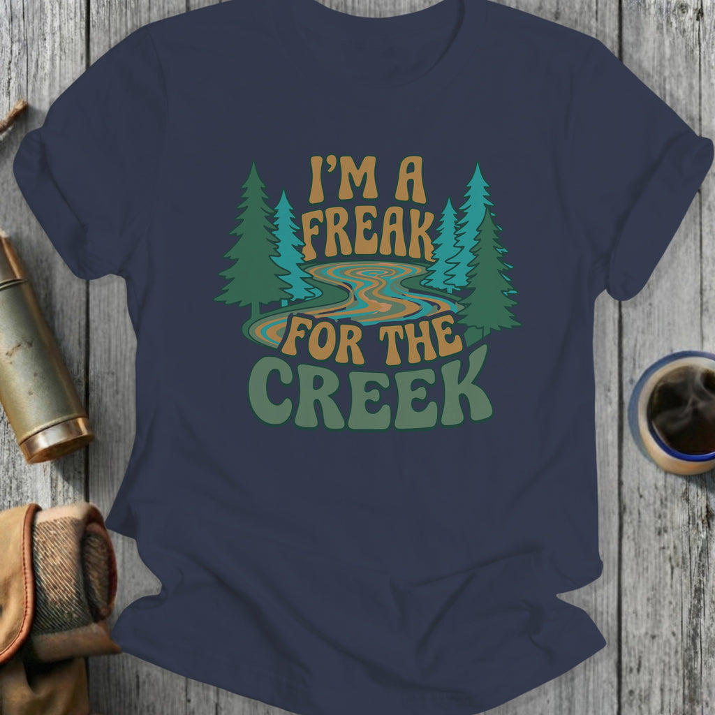Navy t-shirt with "I'm a freak for the creek" text and forest design.