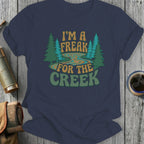 Navy t-shirt with "I'm a freak for the creek" text and forest design.