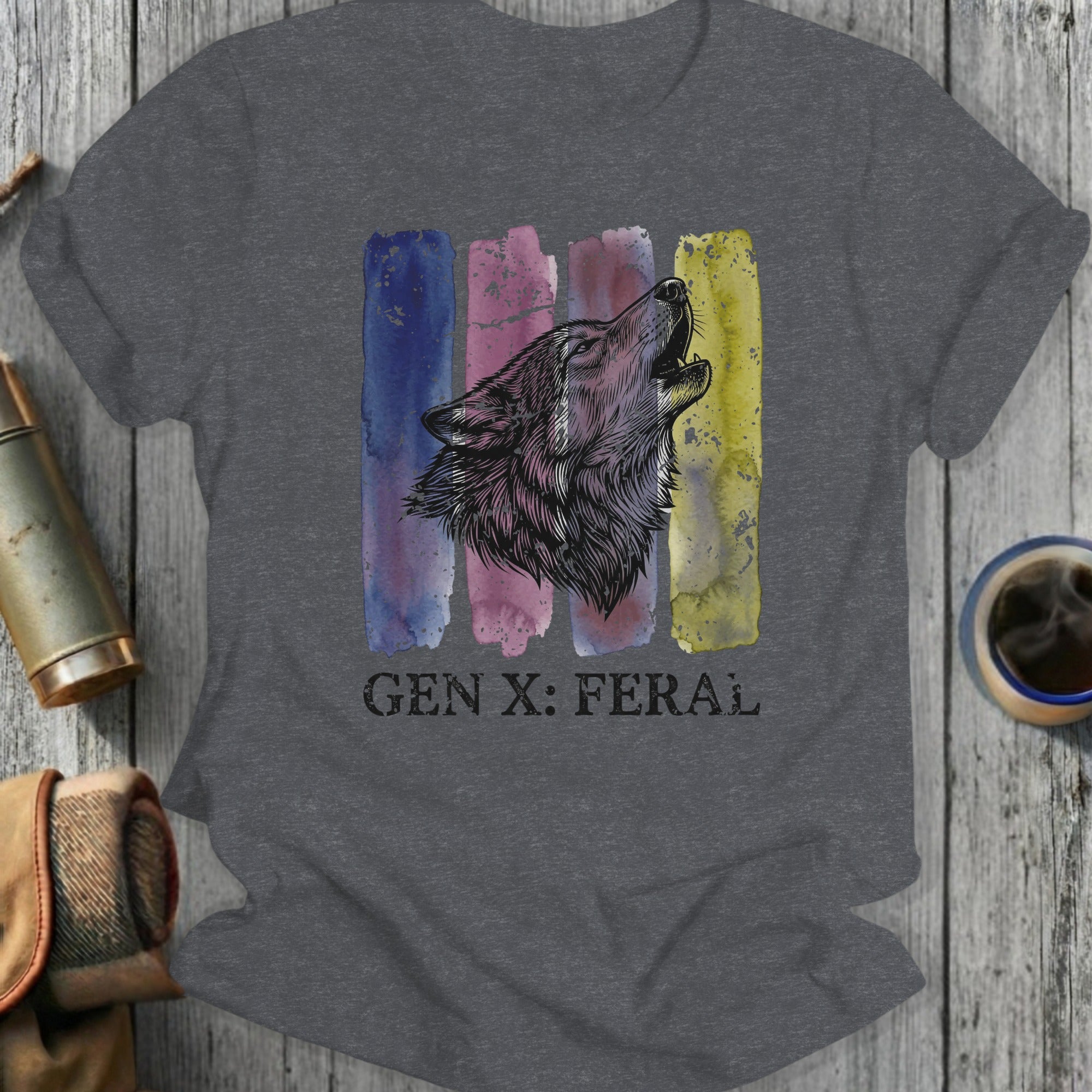 Dark grey t-shirt with a howling wolf over watercolor stripes and "GEN X: FERAL" text.