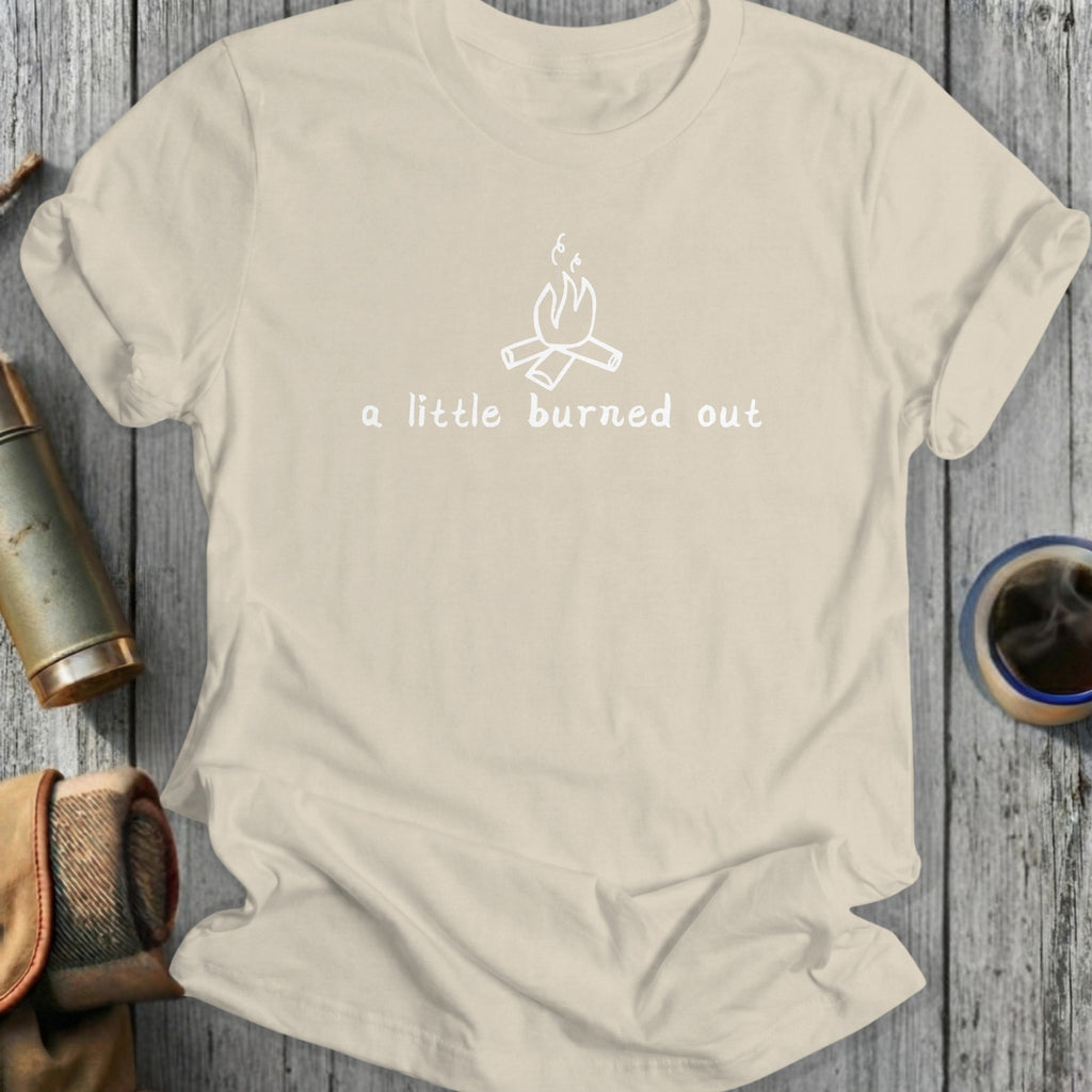 Cream t-shirt with white campfire graphic and text "a little burned out".