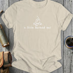 Cream t-shirt with white campfire graphic and text "a little burned out".