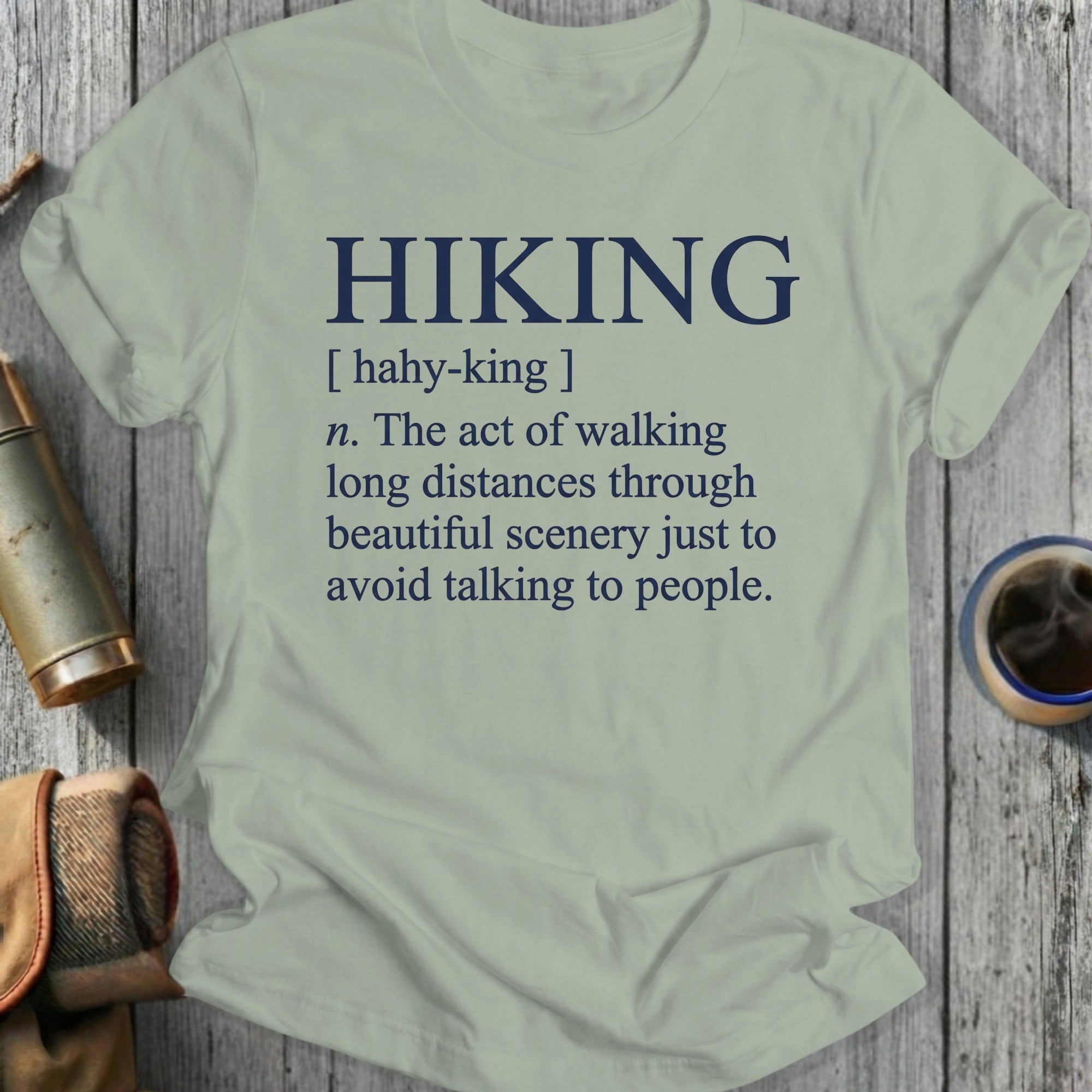 Light gray t-shirt with dark blue text defining "HIKING".
