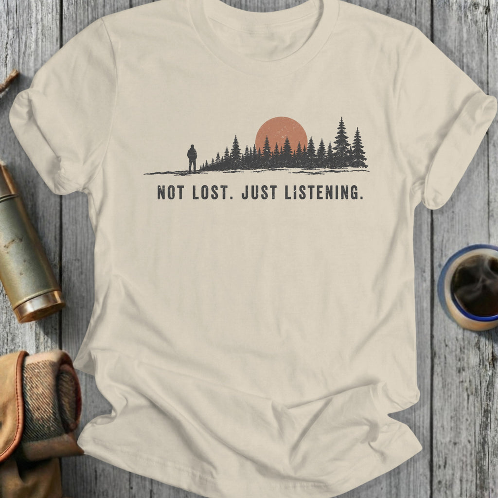 T-shirt with a forest scene, a hiker, and the text NOT LOST. JUST LISTENING.