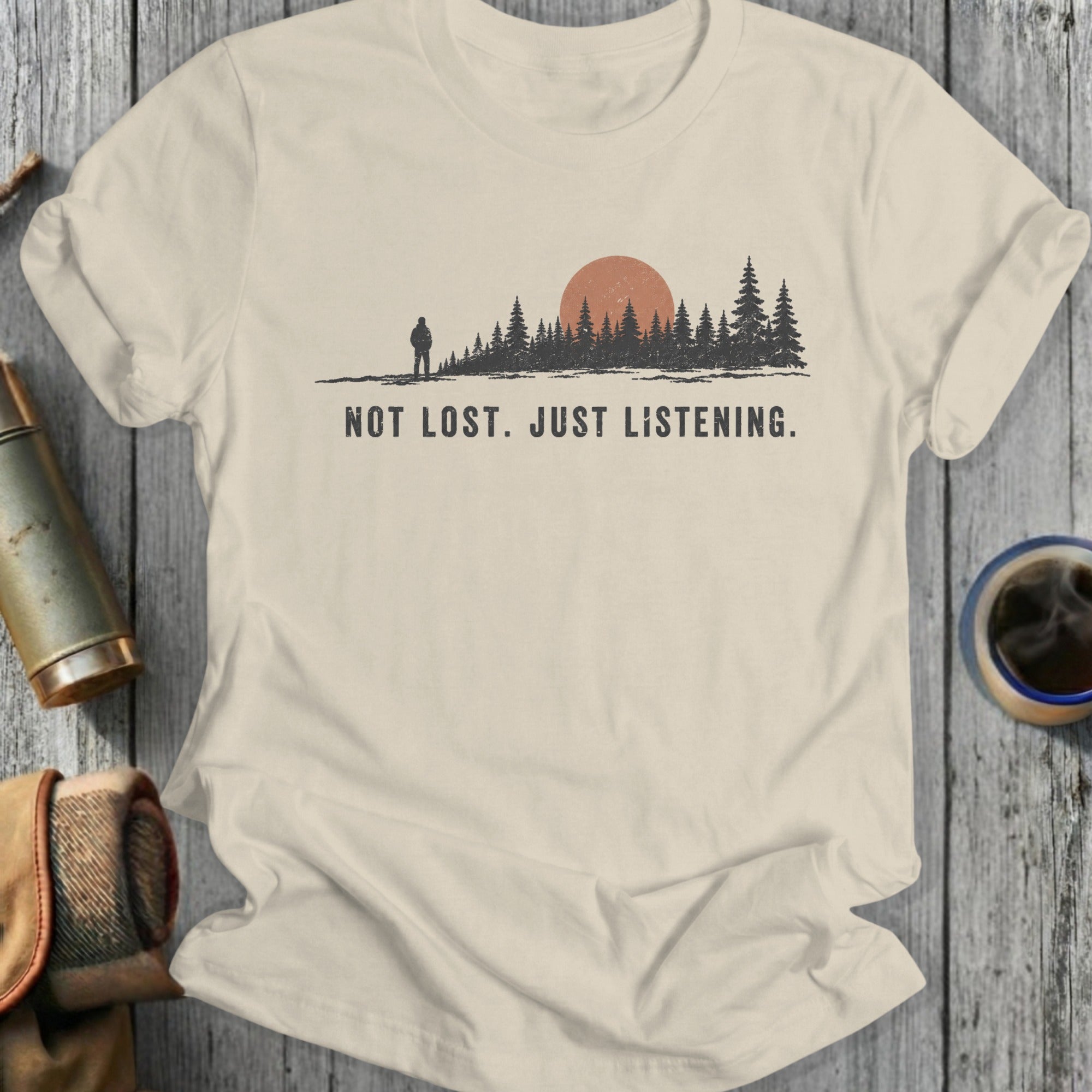 T-shirt with a forest scene, a hiker, and the text NOT LOST. JUST LISTENING.