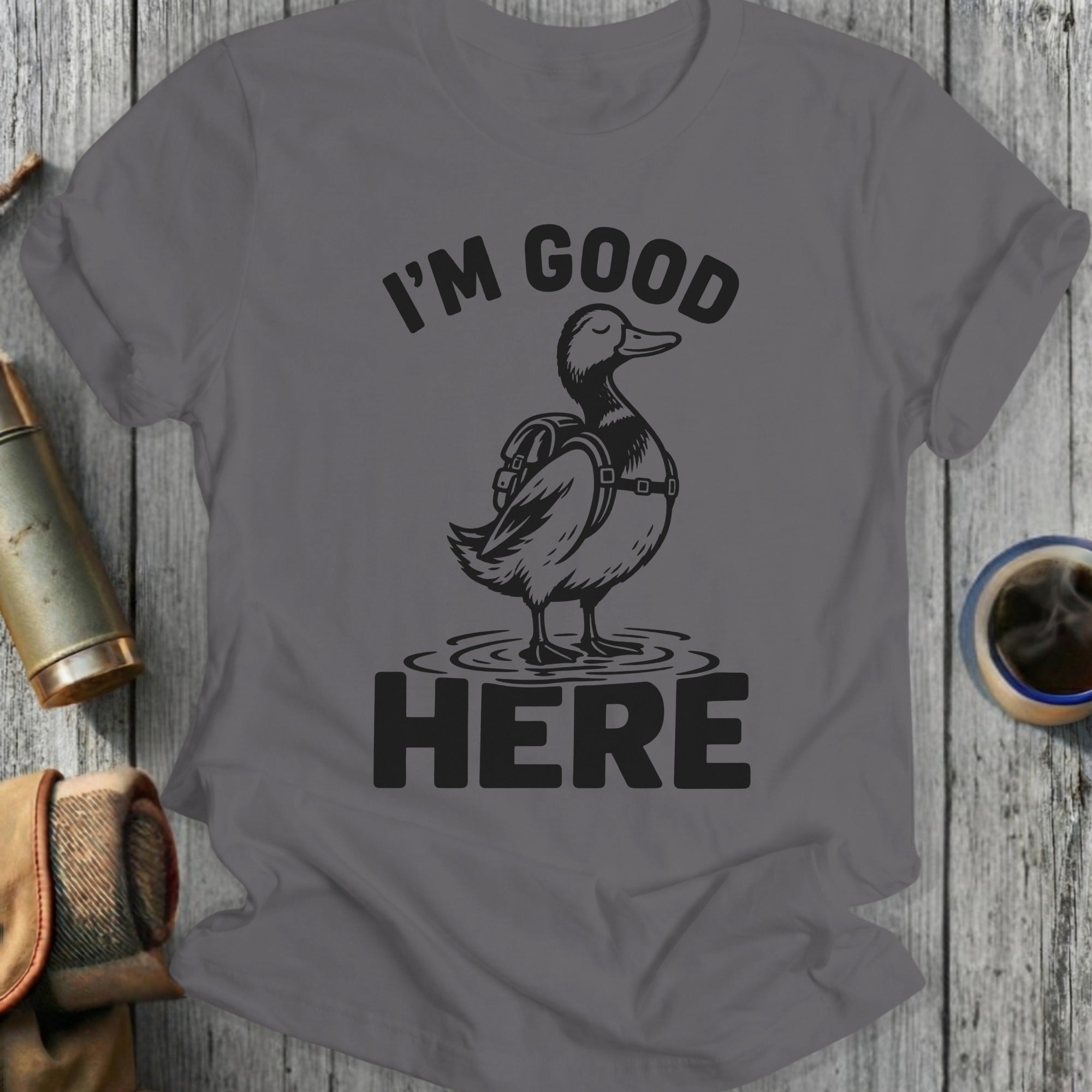 Graphic tee with a duck wearing a backpack, reads "I'M GOOD HERE."