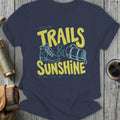 Navy t-shirt with "Chasing Trails & Sunshine" graphic and hiker's boot and sleeping bag.