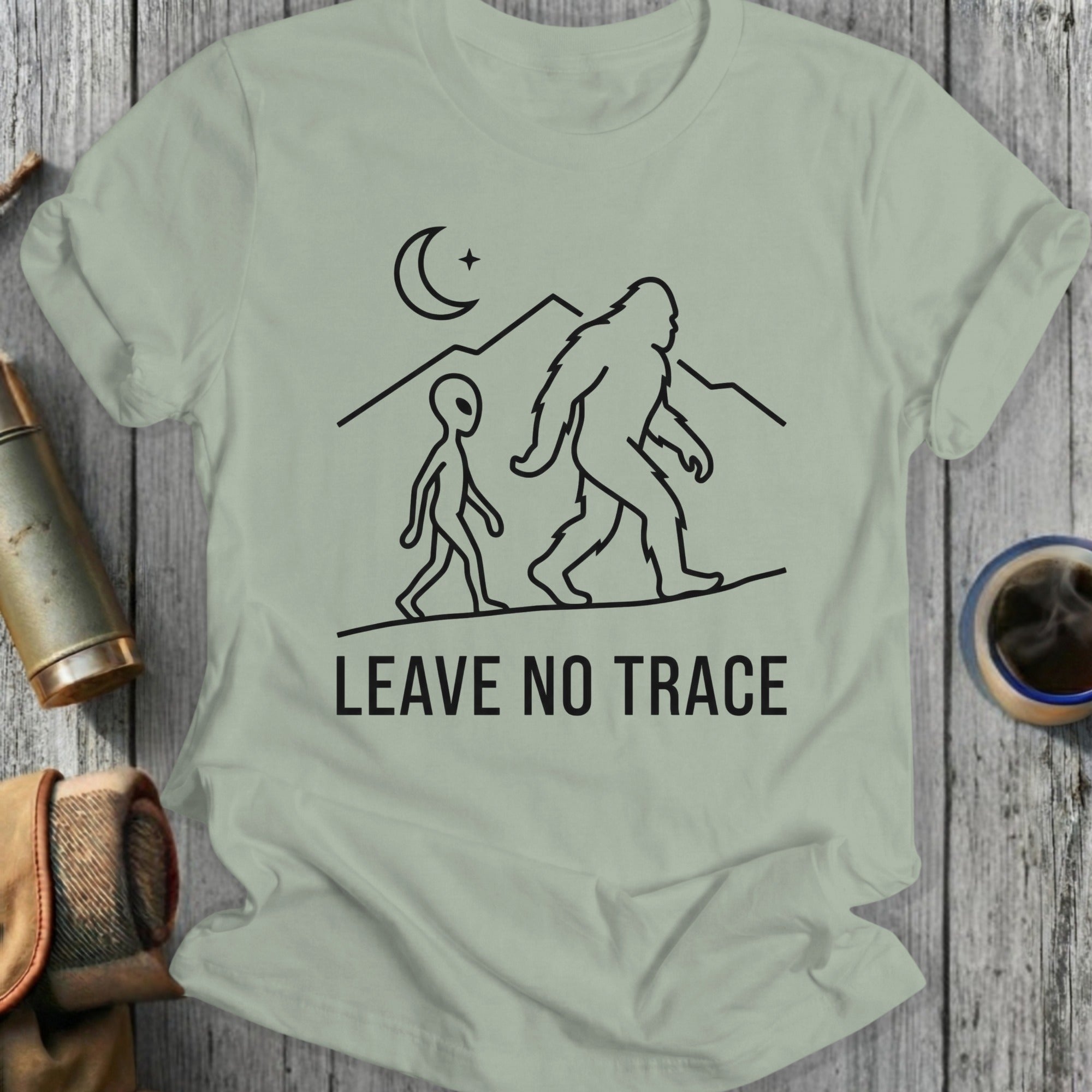 Bigfoot and alien walk under moon with "Leave No Trace" text.