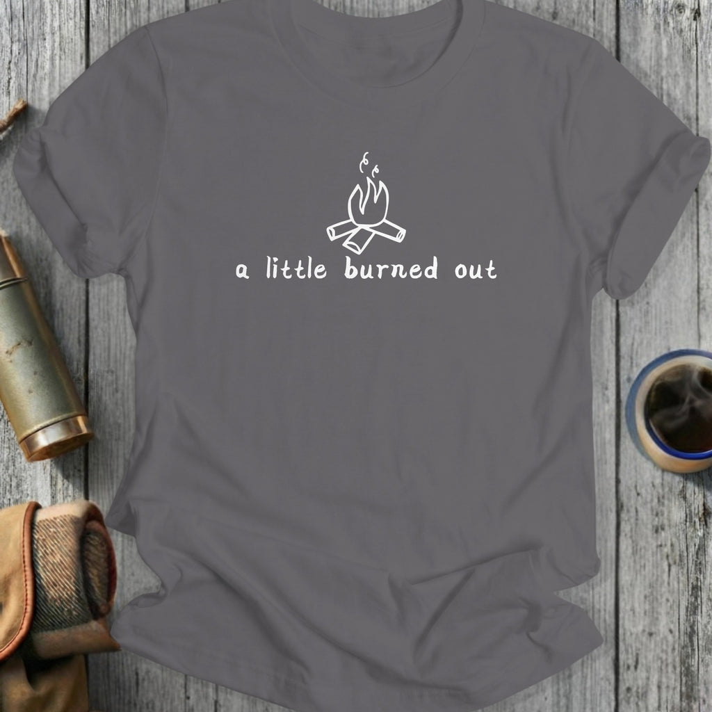Gray t-shirt with a white line drawing of a campfire and text "a little burned out".