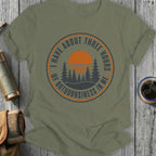 Olive green t-shirt with circular design: "I Have About Three Hours of Outdoorsiness In Me"