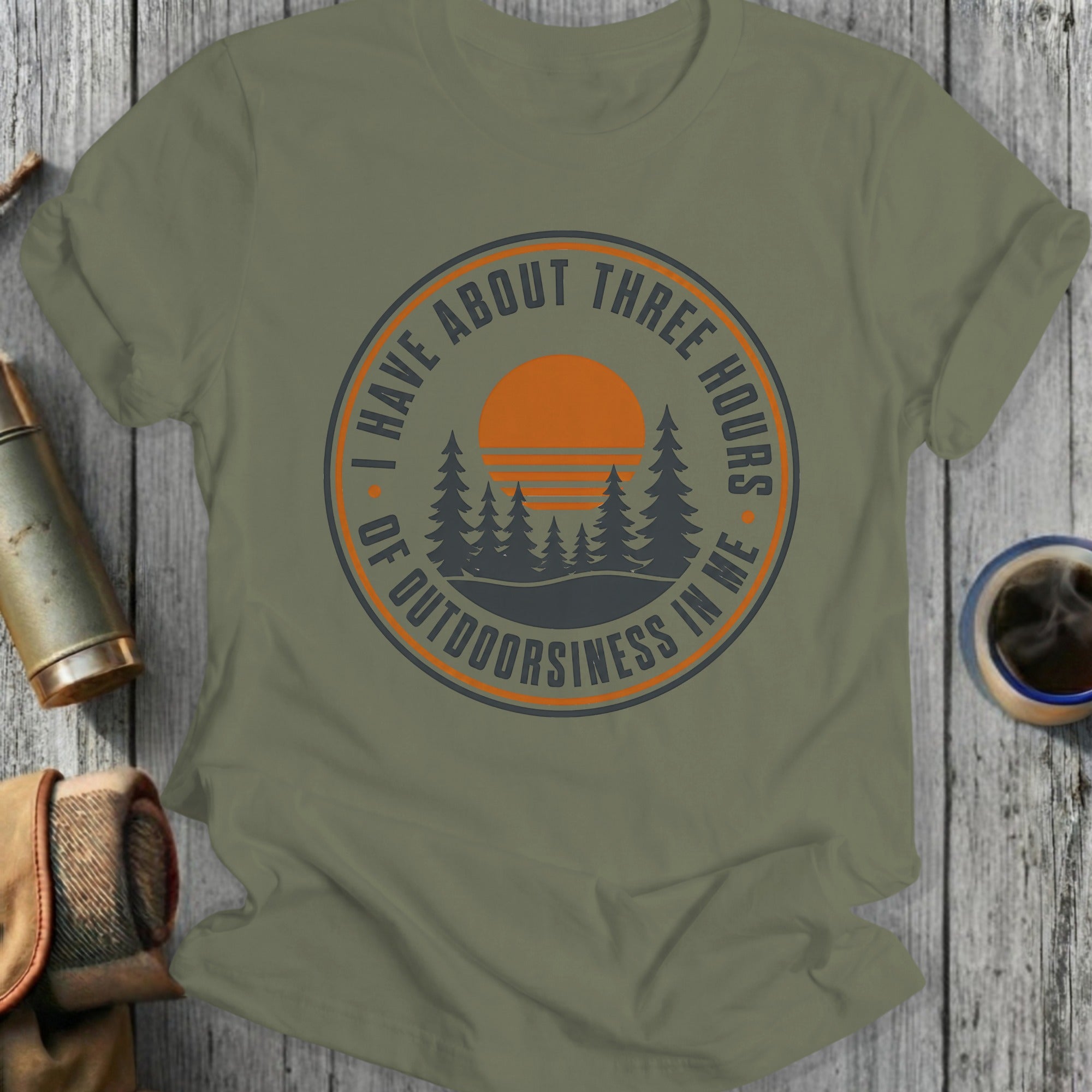 Olive green t-shirt with circular design: "I Have About Three Hours of Outdoorsiness In Me"