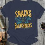 Navy t-shirt with "Living on Snacks & Switchbacks" graphic and text.