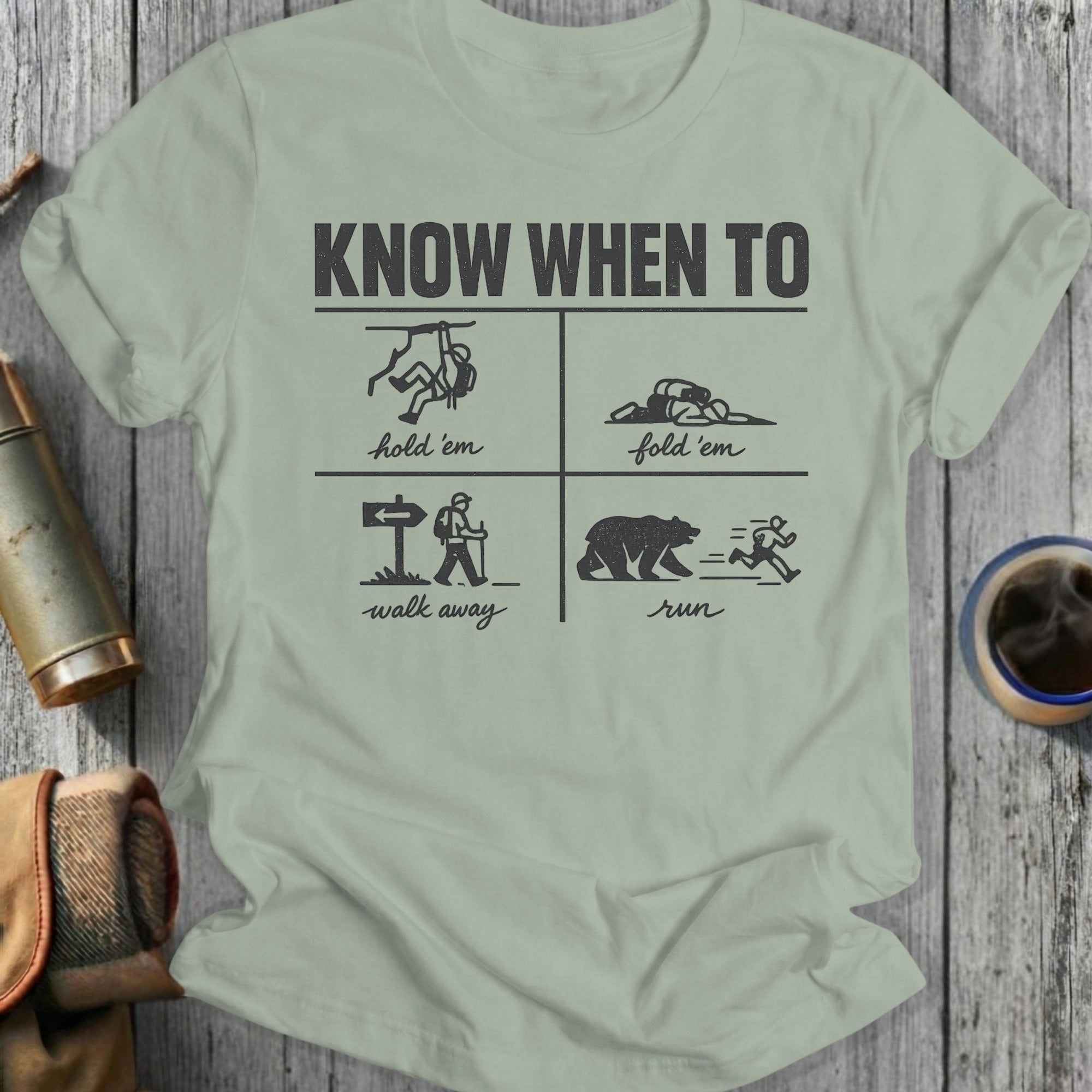 T-shirt with four panels: climbing, playing dead, walking away, and running from a bear.
