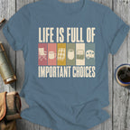 T-shirt with text "LIFE IS FULL OF IMPORTANT CHOICES" and camping icons.