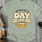 T-shirt with "You Had Me At Day Drinking" and a cooler graphic.