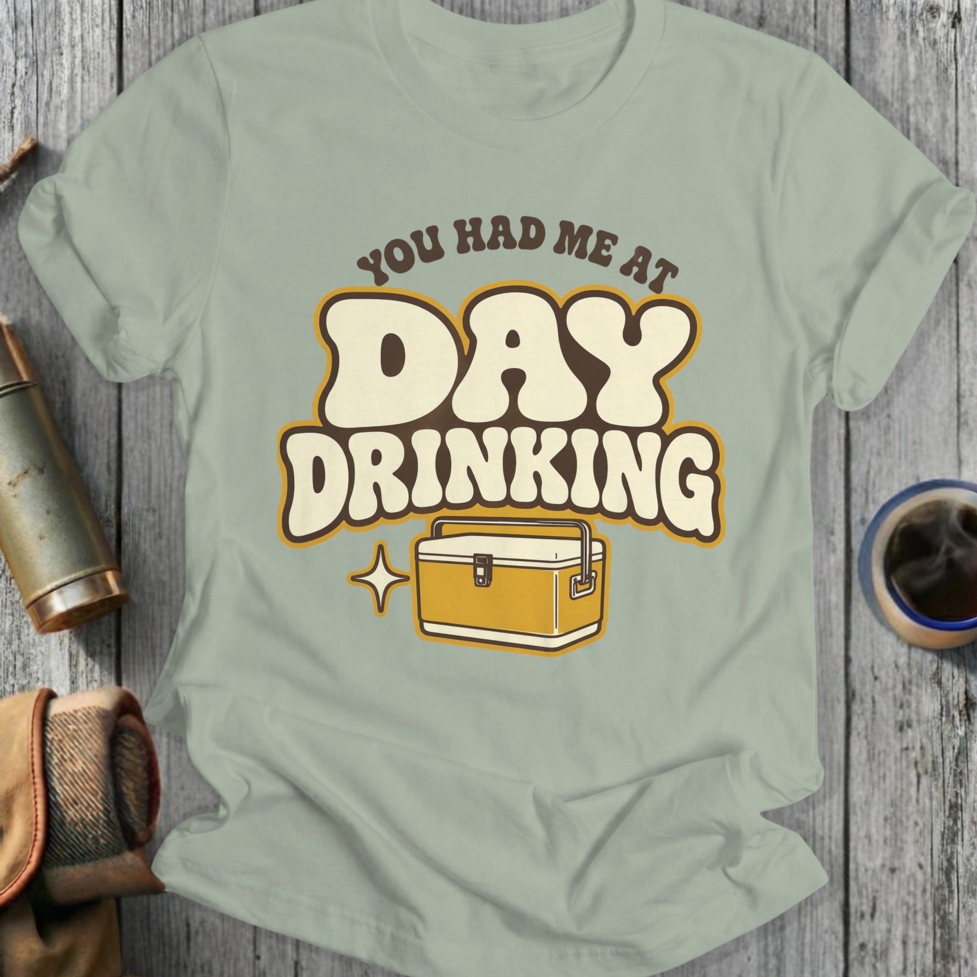 T-shirt with "You Had Me At Day Drinking" and a cooler graphic.
