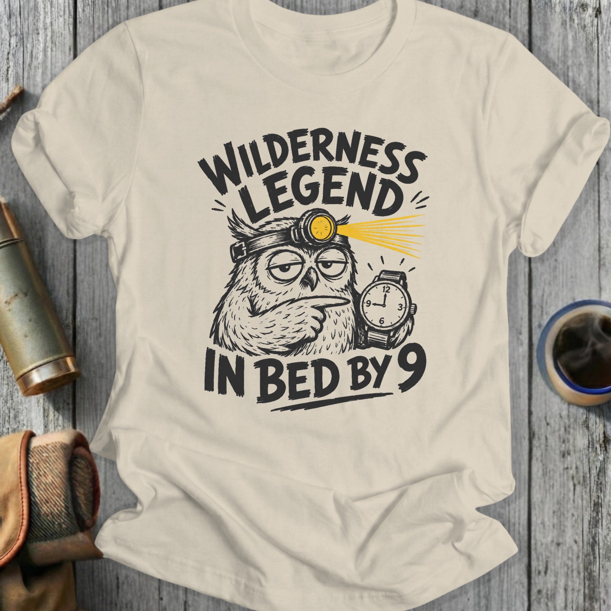 T-shirt with owl graphic and text: Wilderness Legend In Bed By 9.