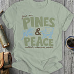 Light green t-shirt with text "give me PINES & PEACE outside whenever possible".