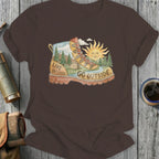 Brown t-shirt with a boot graphic featuring a landscape and the words "LIVE UNFILTERED. GO OUTSIDE."
