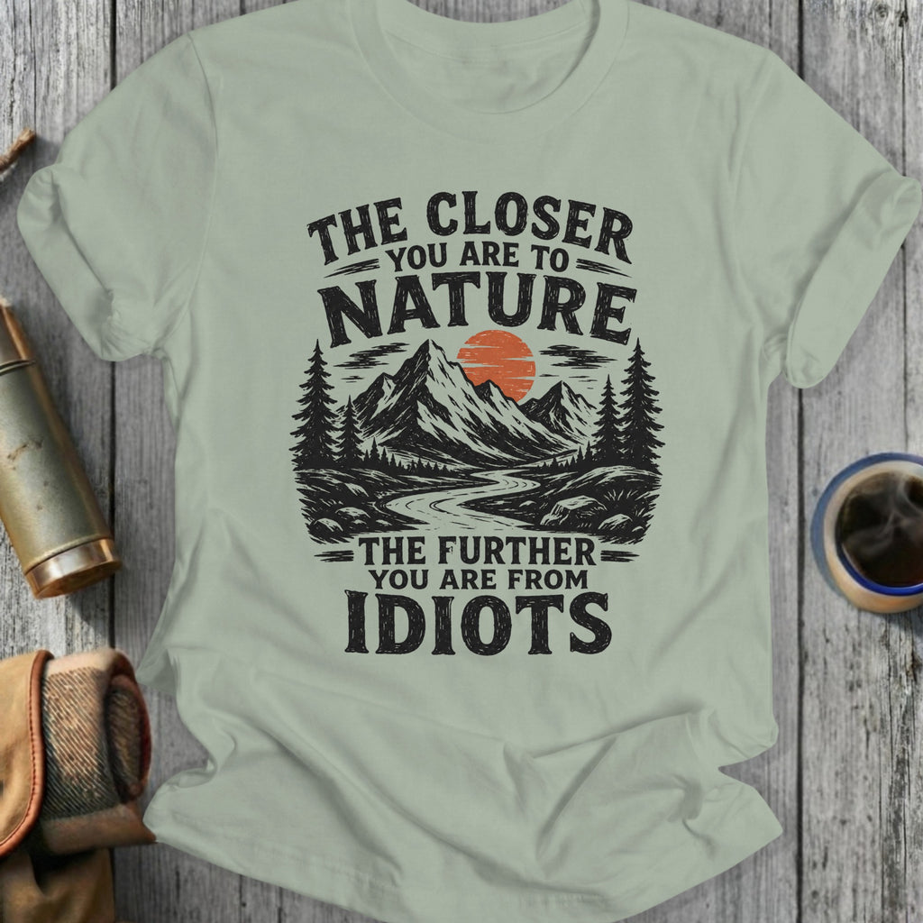 Light green t-shirt with graphic: "The Closer You Are To Nature, The Further You Are From Idiots."