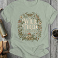 Green t-shirt with "Wild, Tired & Doing My Best" and floral border.