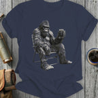 Gorilla in a chair holding a mug of beer, on a t-shirt.