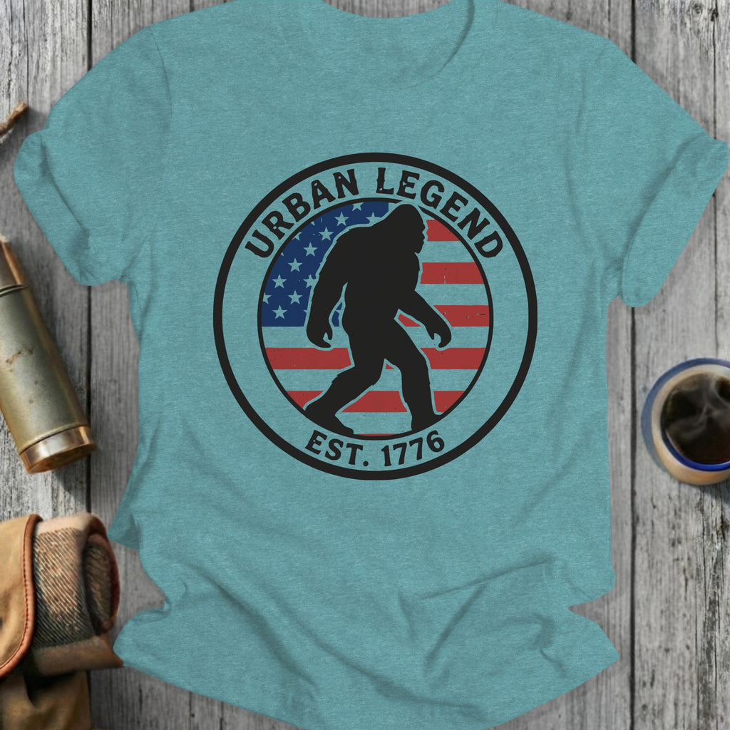 T-shirt with Bigfoot silhouette inside an "Urban Legend Est. 1776" circle and American flag.