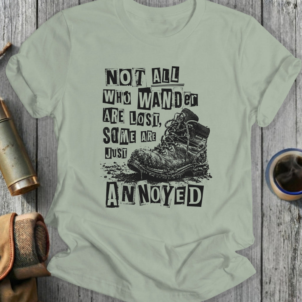 T-shirt with "Not All Who Wander Are Lost, Some Are Just Annoyed" text and boot.