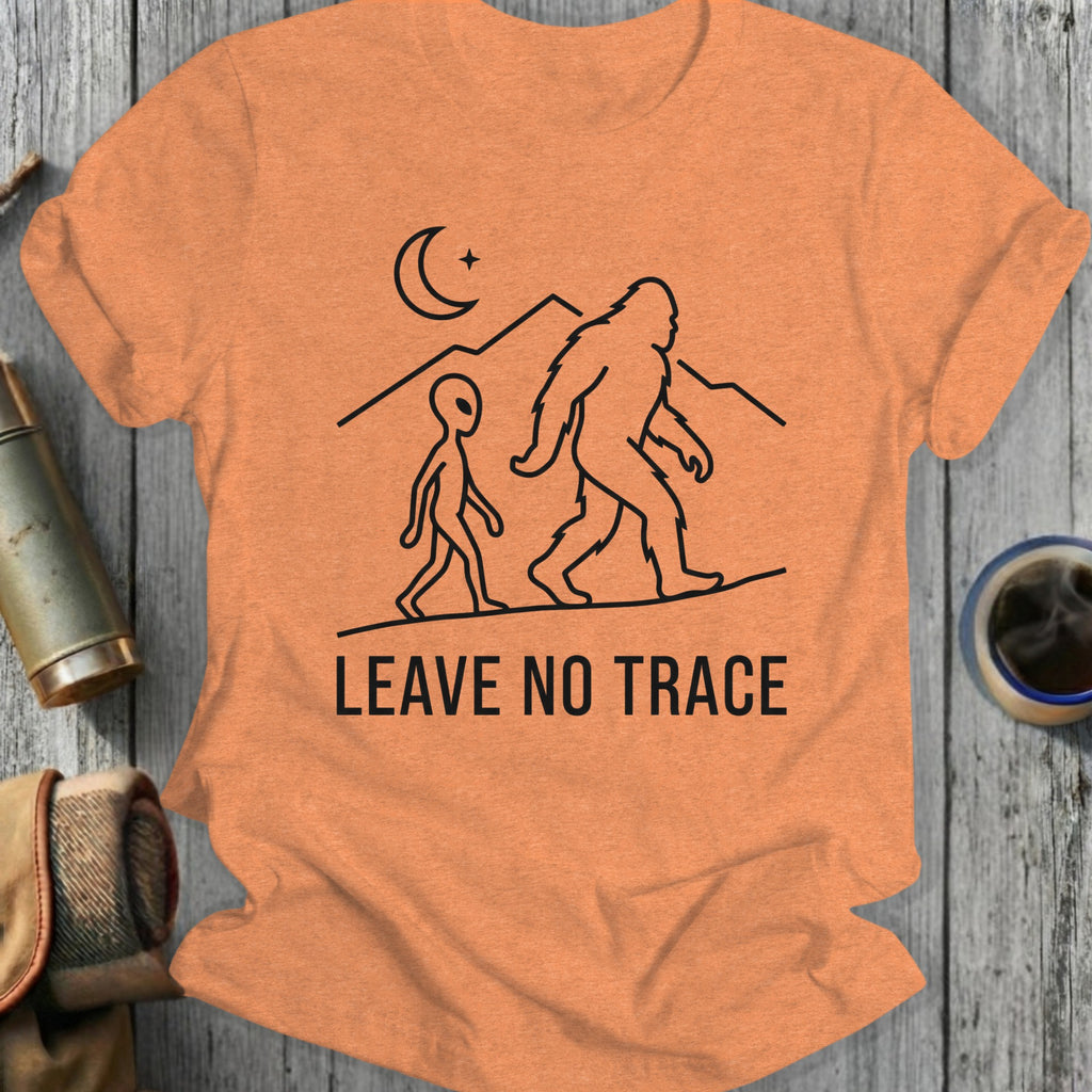 Bigfoot and alien walking under moon, "LEAVE NO TRACE" text.