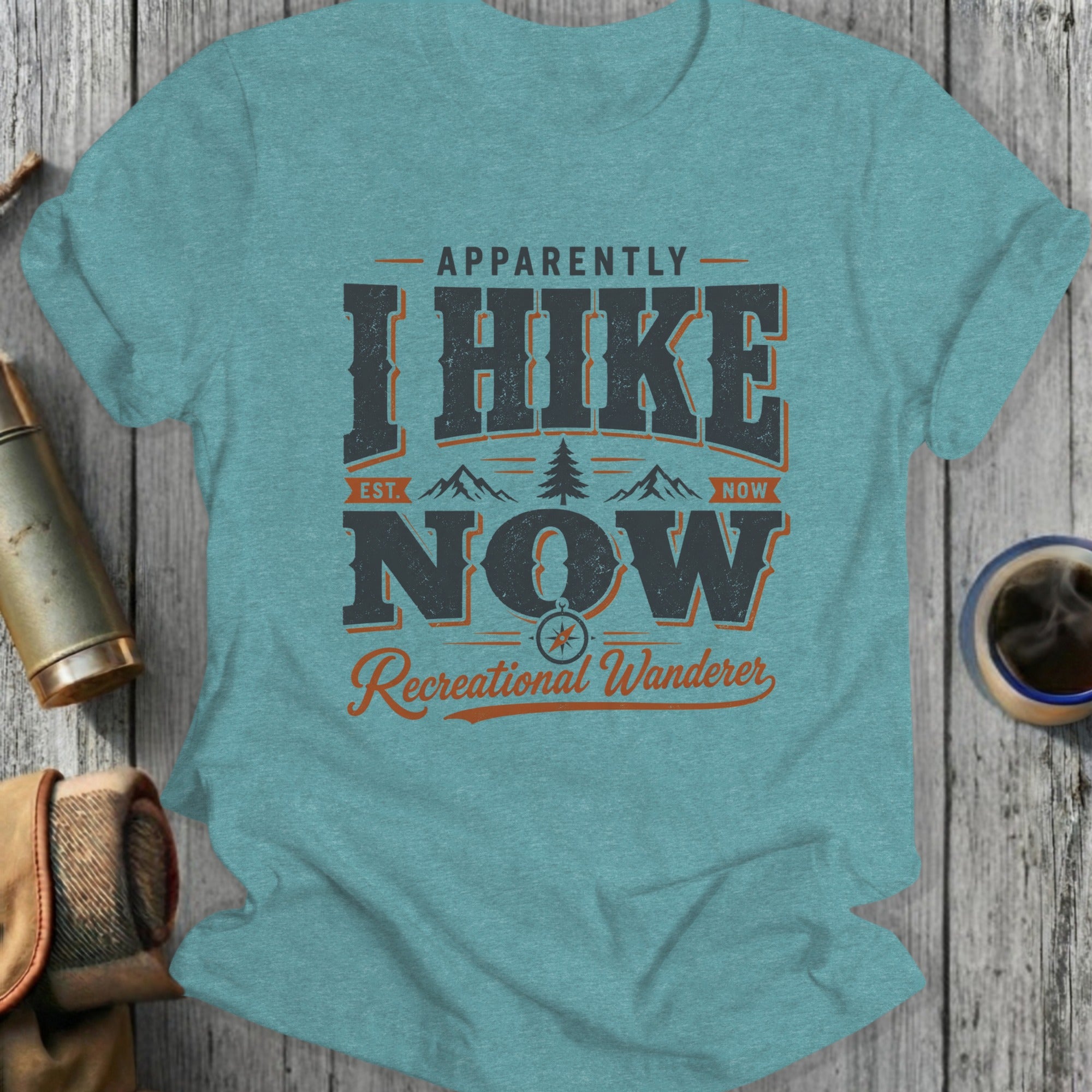 T-shirt with "Apparently I Hike Now" graphic and compass.