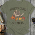 Hiking boots surrounded by fall leaves with text "Collecting Colors, Not Miles."
