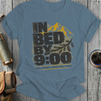 Blue t-shirt with "IN BED BY 9:00 The Great Indoorsy Tour" text and mountain graphic.