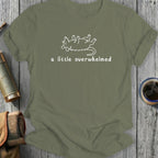 Olive green t-shirt with a white illustrative outline of a possum lying on its back with text "a little overwhelmed".