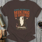 Opossum on tree stump with open mouth and outstretched arms, text "Rejoice, The Time To Go Hiking Is Upon Us!".
