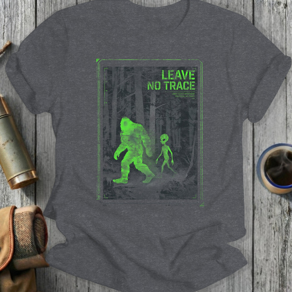 T-shirt with green Bigfoot and alien graphic and "LEAVE NO TRACE" text.