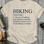 T-shirt with dictionary definition of "Hiking": walking long distances through scenery to avoid talking.