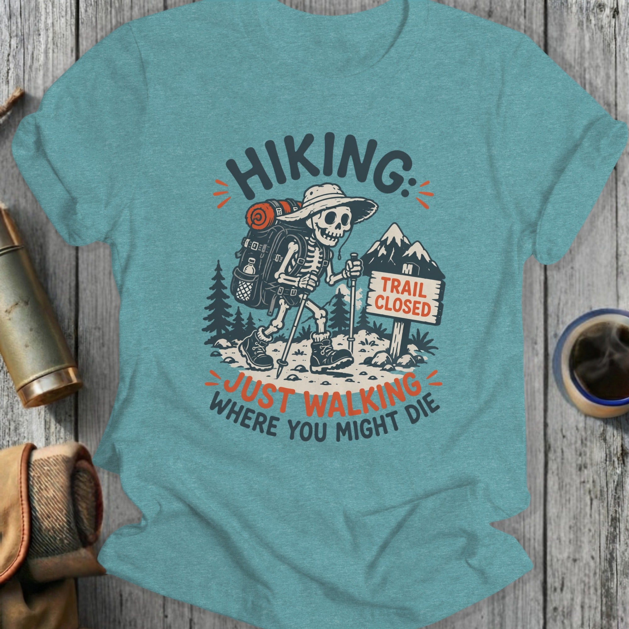 Skeleton hiker wearing hat and backpack on trail, "Hiking: Just Walking Where You Might Die" text.