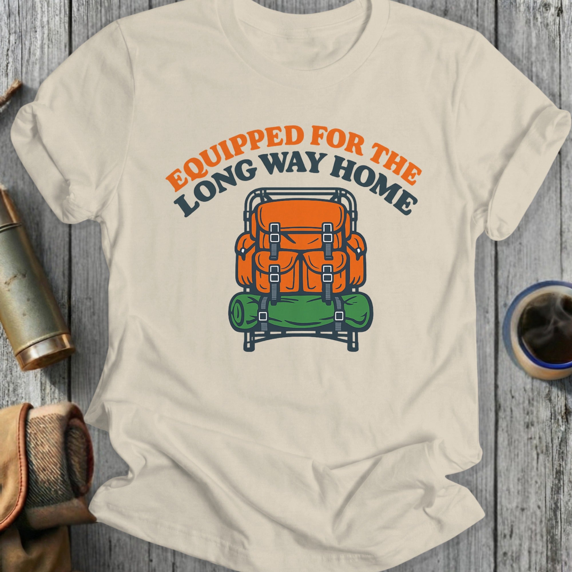 Orange backpack with rolled sleeping bag, text "Equipped for the long way home".