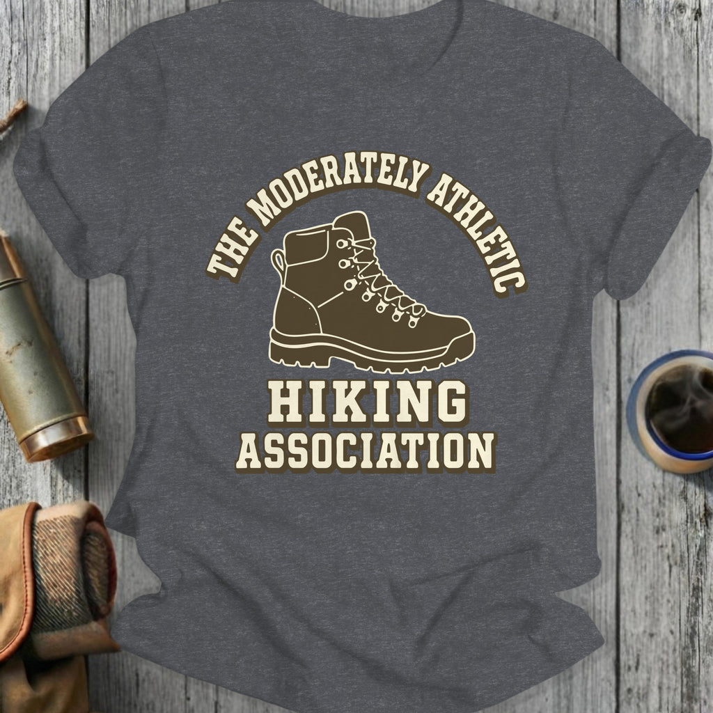 Dark grey t-shirt with a hiking boot and text reading Moderately Athletic Hiking Association.