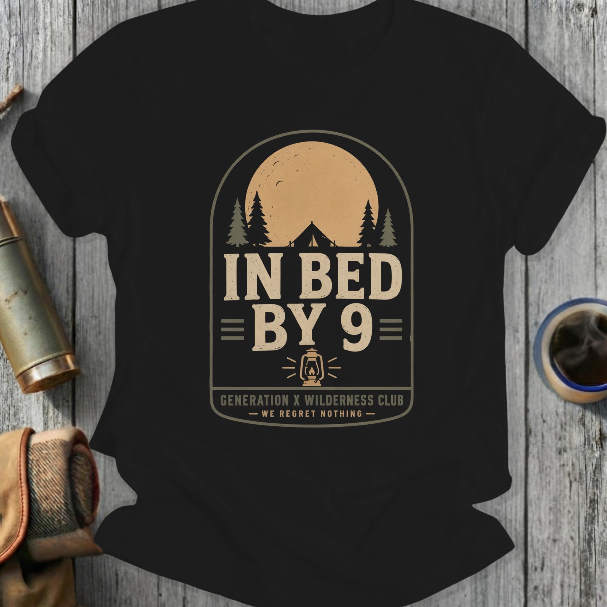 Black t-shirt with "In Bed By 9 Generation X Wilderness Club" text.