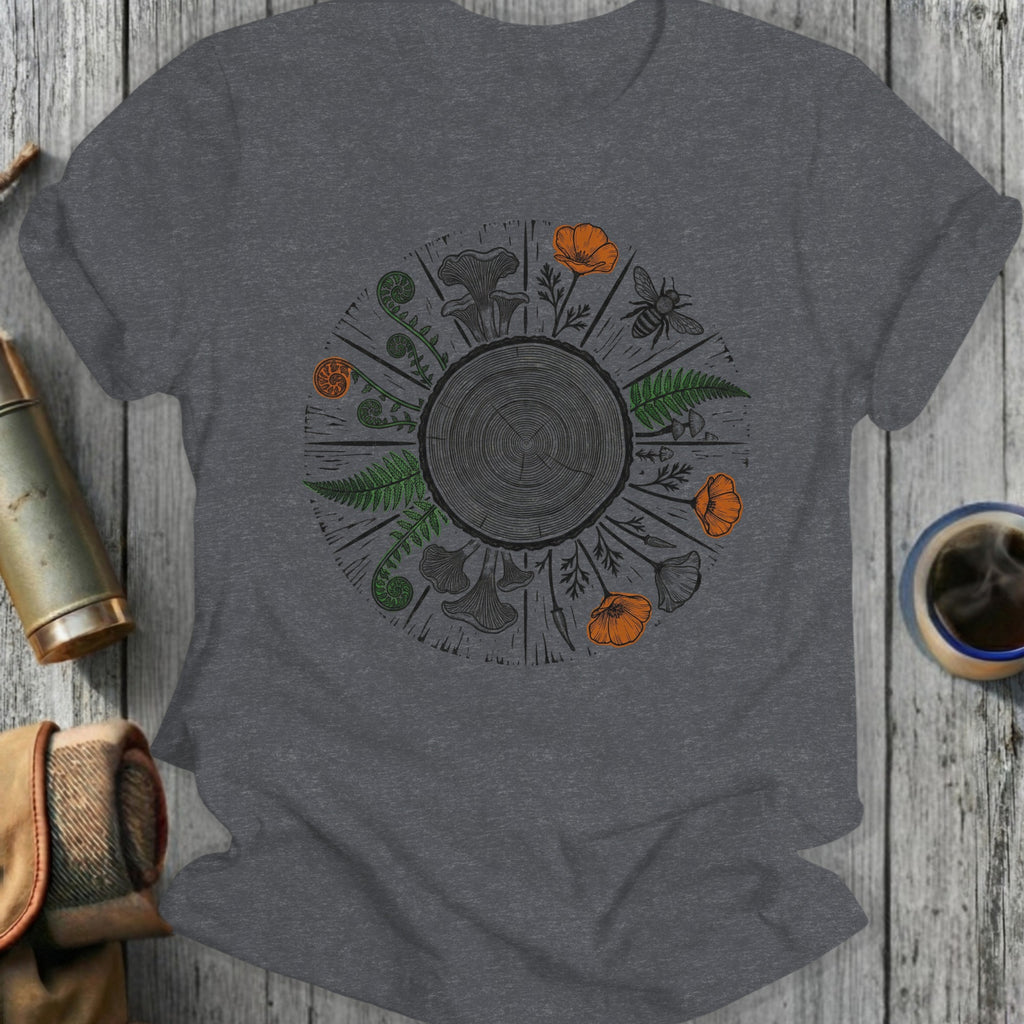 Circular design of forest elements including mushrooms, ferns, flowers, and a bee.
