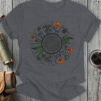 Circular design of forest elements including mushrooms, ferns, flowers, and a bee.