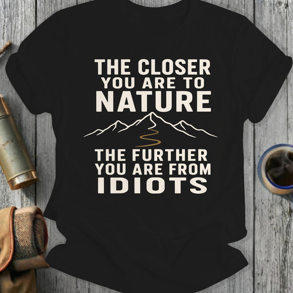 Black t-shirt with "The closer you are to nature, the further you are from idiots" text.