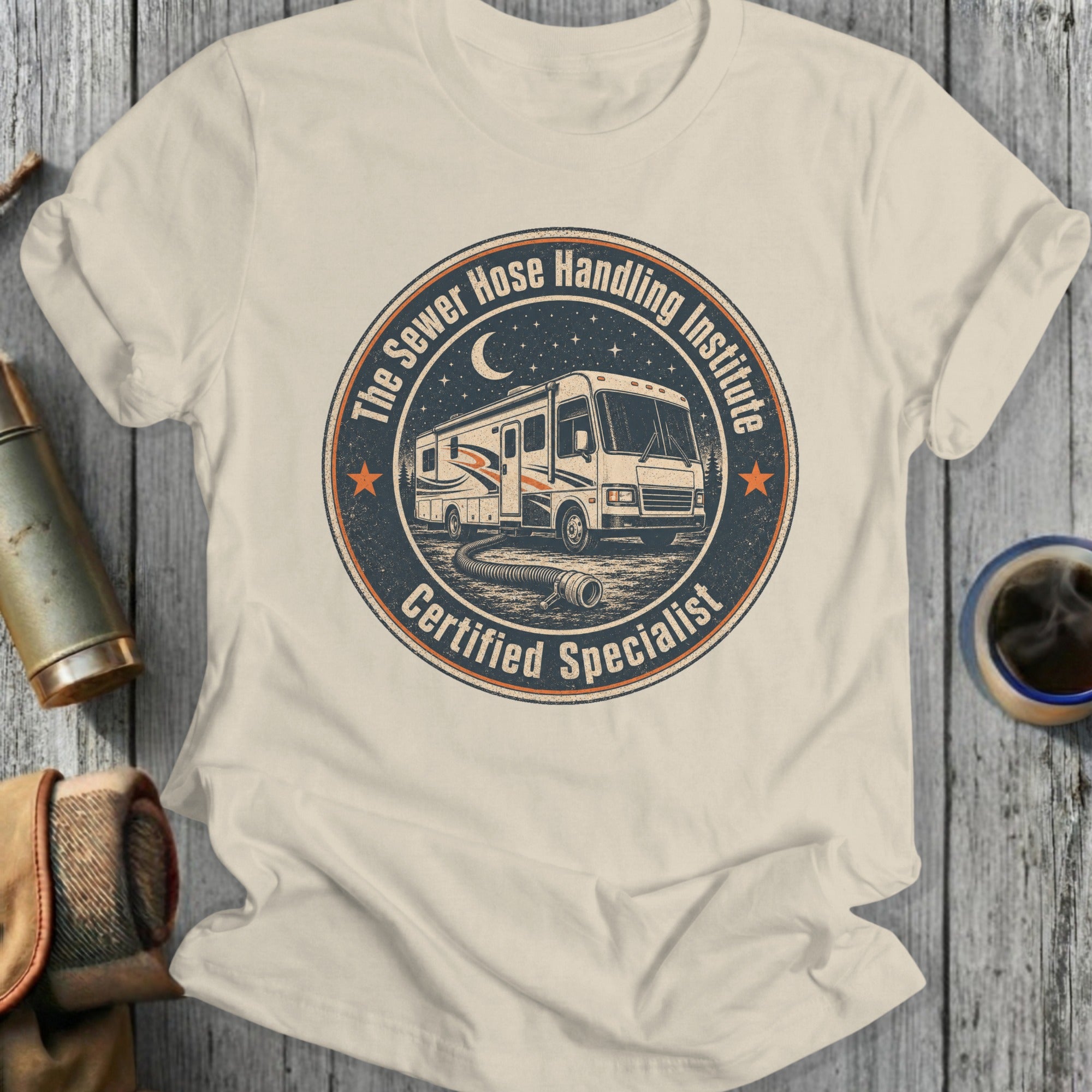 RV "The Sewer Hose Handling Institute Certified Specialist" graphic on a cream t-shirt.